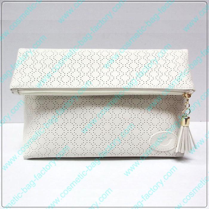 Howllow pattern folding makeup cosmetic bag with tassel